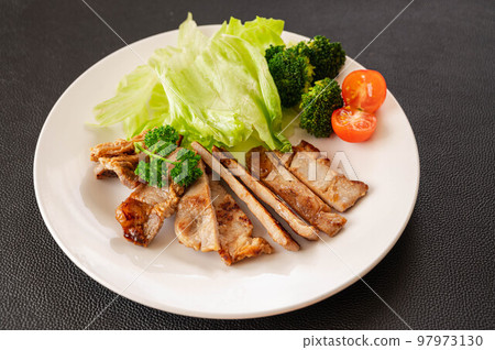 pork saute on black background pork saute on black background 97973130