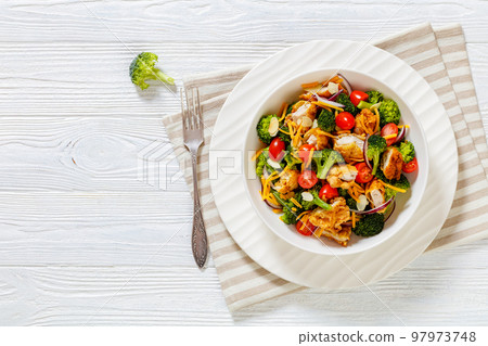 fried chicken tenders broccoli salad in bowl fried chicken tenders broccoli salad in bowl 97973748