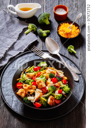 fried chicken tenders broccoli salad in bowl fried chicken tenders broccoli salad in bowl 97973752
