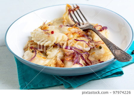Homemade vareniki (dumpling) with cabbage. 97974226