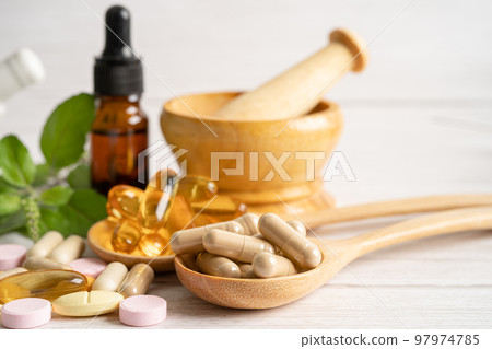 Alternative medicine herbal organic capsule with vitamin E omega 3 fish oil, mineral, drug with herbs leaf natural supplements for healthy good life. Alternative medicine herbal organic capsule with vitamin E omega 3 fish oil, mineral, drug with herbs leaf natural supplements for healthy good life. 97974785