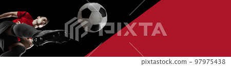 Bottom view on man, professional soccer, football player training, hitting ball over black red background. Banner Bottom view on man, professional soccer, football player training, hitting ball over black red background. Banner 97975438