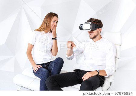 Couple having fun playing with virtual reality 97976854