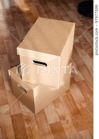 boxes on top of each other close-up on the floor. Moving theme with cardboard boxes boxes on top of each other close-up on the floor. Moving theme with cardboard boxes 97977886