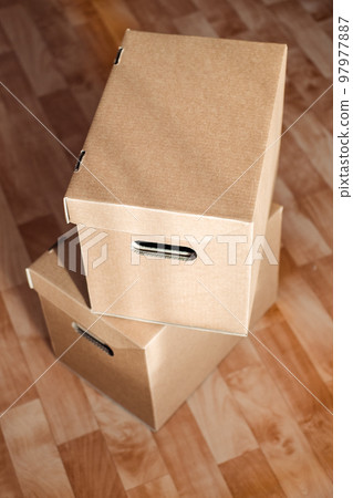 boxes on top of each other close-up on the floor. Moving theme with cardboard boxes boxes on top of each other close-up on the floor. Moving theme with cardboard boxes 97977887