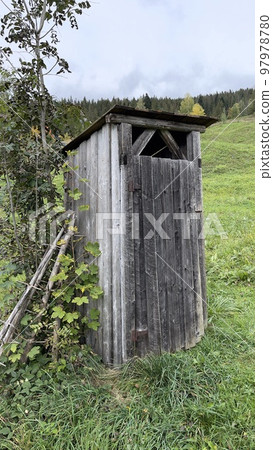 Old wooden toilet in the forest in autumn, Carpathian Ukraine Old wooden toilet in the forest in autumn, Carpathian Ukraine 97978780