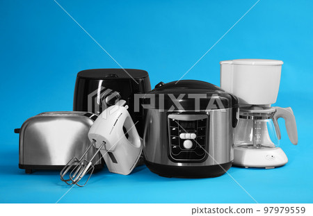 Set of different household appliances on light blue background Set of different household appliances on light blue background 97979559