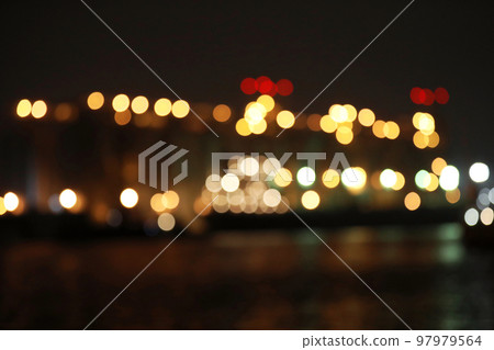 Blurred view of docks at night. Bokeh effect Blurred view of docks at night. Bokeh effect 97979564