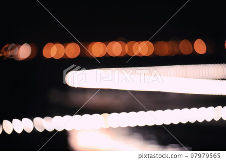 Blurred view of night city. Bokeh effect Blurred view of night city. Bokeh effect 97979565