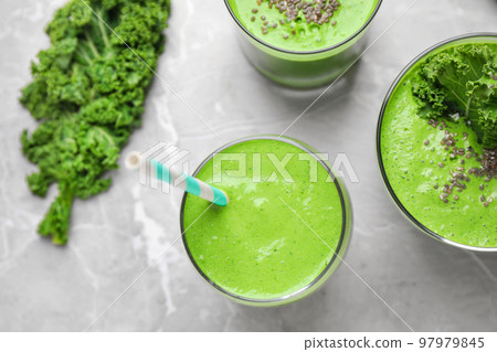Tasty kale smoothie on light grey marble table, flat lay 97979845