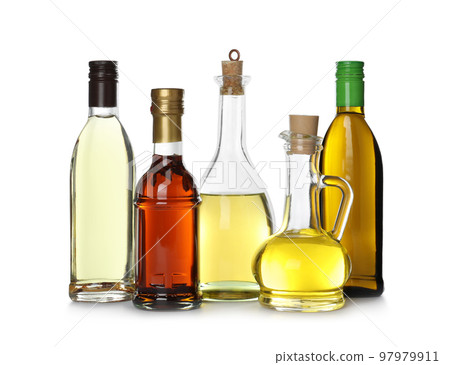 Different sorts of cooking oil in bottles isolated on white Different sorts of cooking oil in bottles isolated on white 97979911