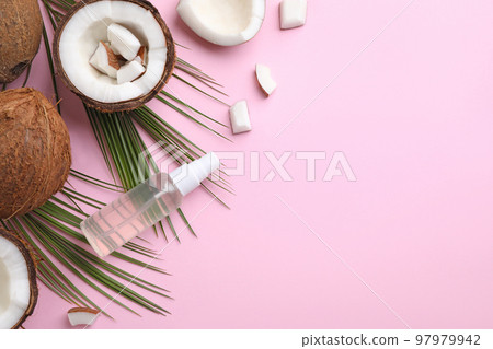 Flat lay composition with coconut oil on pink background, space for text Flat lay composition with coconut oil on pink background, space for text 97979942