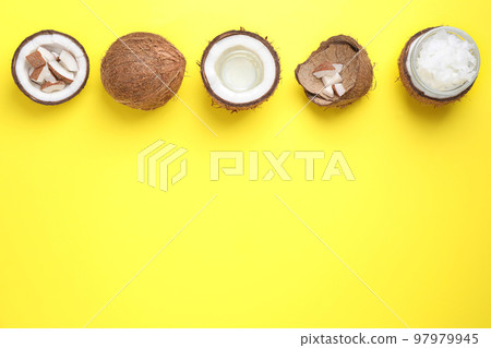 Flat lay composition with coconut oil on yellow background, space for text Flat lay composition with coconut oil on yellow background, space for text 97979945