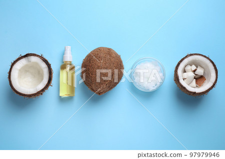Flat lay composition with coconut oil on light blue background 97979946