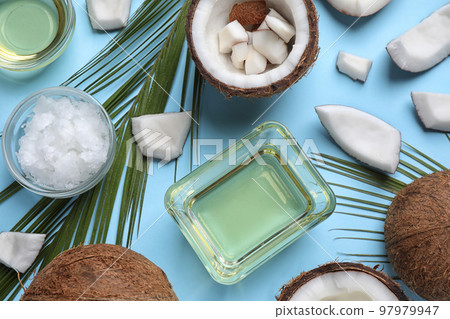 Flat lay composition with coconut oil on light blue background 97979947