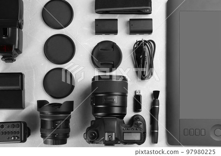 Flat lay composition with equipment for professional photographer on grey marble table Flat lay composition with equipment for professional photographer on grey marble table 97980225