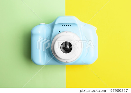 Light blue toy camera on color background, top view. Future photographer 97980227