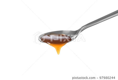 Salted caramel in spoon isolated on white 97980244