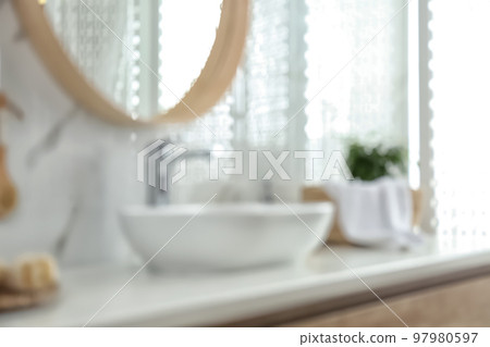 Blurred view of stylish modern bathroom with vessel sink Blurred view of stylish modern bathroom with vessel sink 97980597
