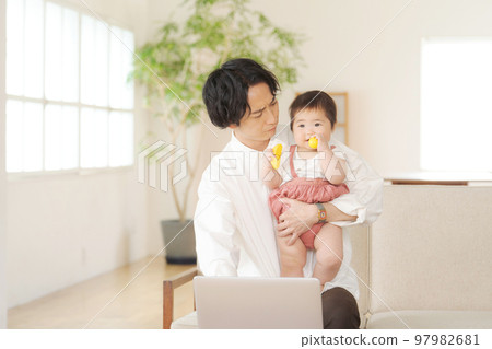 Papa holding a baby Papa holding a baby 97982681