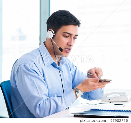 Male call-center operator in business concept Male call-center operator in business concept 97982756
