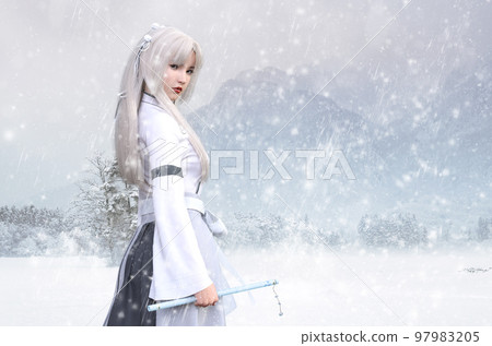 Attractive white-clad woman looking back at a snowy landscape Attractive white-clad woman looking back at a snowy landscape 97983205