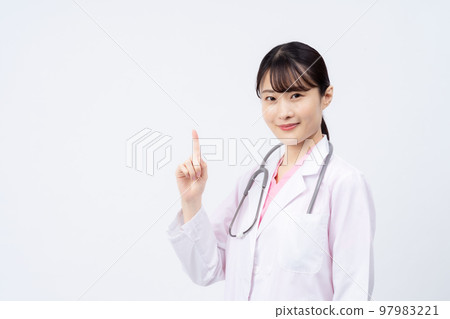 Young female doctor (pointing pose) 97983221