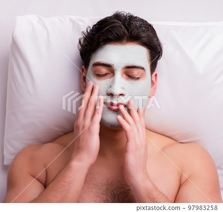 Handsome man in spa massage concept 97983258