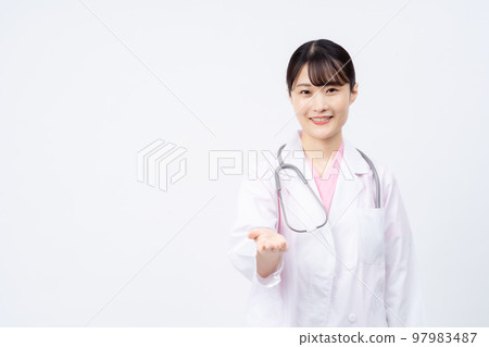 Young female doctor reaching out 97983487