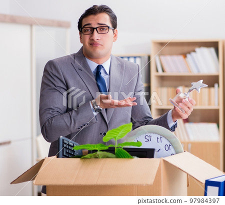 Man moving office with box and his belongings 97984397