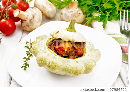 Patisson stuffed with liver in plate on board Patisson stuffed with liver in plate on board 97984731