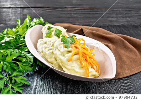 Patties pegodi in plate on dark board 97984732