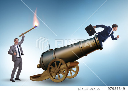 Concept of lay-off with businessman and cannon 97985849