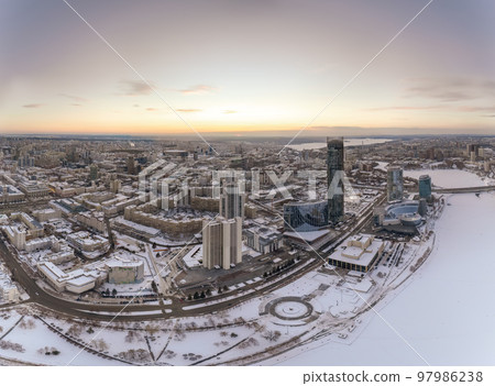 Yekaterinburg city with Buildings of Regional Government and Parliament, Dramatic Theatre, Iset Tower, Yeltsin Center, panoramic view at winter sunset. Yekaterinburg city with Buildings of Regional Government and Parliament, Dramatic Theatre, Iset Tower, Yeltsin Center, panoramic view at winter sunset. 97986238