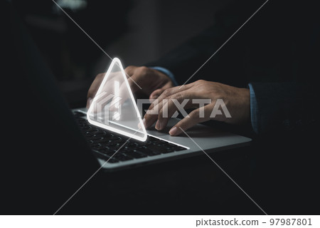 Businessman programmer, developer using laptop computer with triangle caution warning sign for notification error and maintenance concept. 97987801