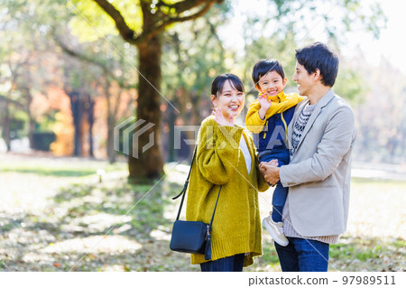 Image of a happy family spending time in the park Image of a happy family spending time in the park 97989511