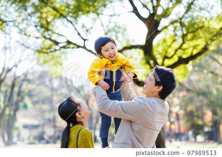 Image of a happy family spending time in the park Image of a happy family spending time in the park 97989513