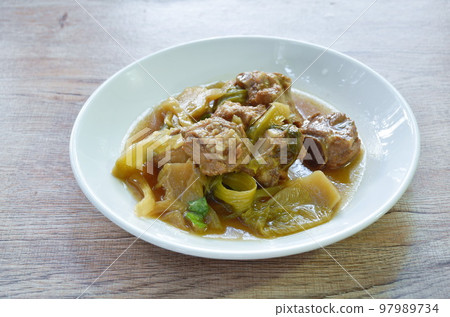 boiled pork bone with pickled cabbage stew on plate 97989734