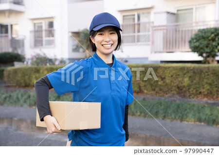 Courier female staff delivering packages Courier female staff delivering packages 97990447