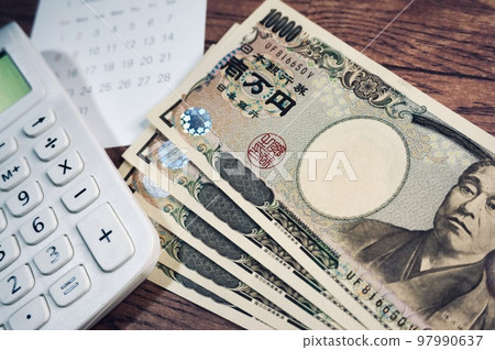10,000 yen bill, calendar and calculator 10,000 yen bill, calendar and calculator 97990637