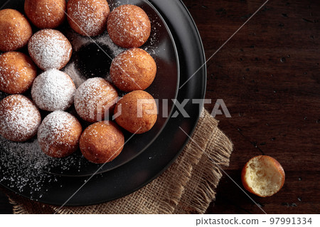 Balls of freshly baked homemade cottage cheese doughnuts. Balls of freshly baked homemade cottage cheese doughnuts. 97991334