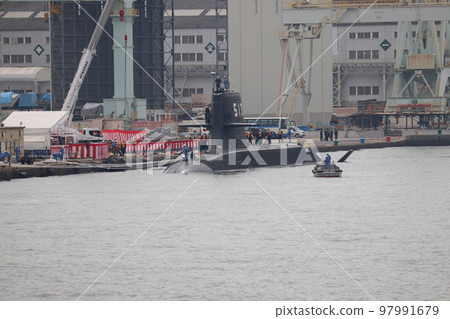Maritime Self-Defense Force submarine "Taigei" and a boat anchored at the shipyard 97991679