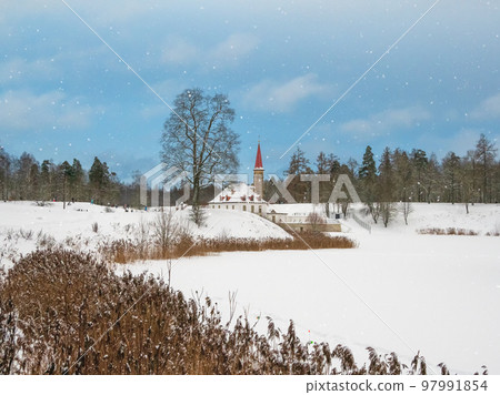 Beautiful landscape with Maltese Palace by the water in winter. Gatchina, Russia. 97991854