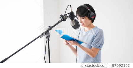 Young woman doing dubbing Narrator image 97992192