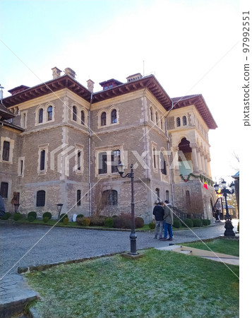 Cantacuzino Castle and yard in a sunny day. Ancient castle in Busteni, Romania and the Carpathian Mountains 97992551