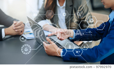 ESG concept of environmental, Green ethical business preserving resources, reducing CO2, Business person team working on laptop virtual smartphone to reduce CO2 emissions carbon . 97992970