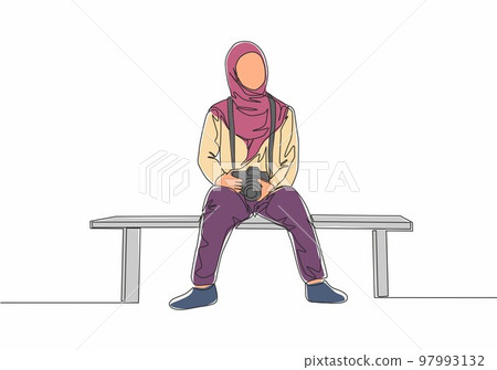 Single continuous line drawing of young cute muslimah sitting on chair while carrying dslr camera. Beautiful Asian woman model in trendy hijab fashion concept one line draw design vector illustration 97993132
