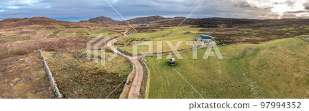 Aerial view of the track to Agnish Lough by Maghery, Dungloe - County Donegal - Ireland. 97994352