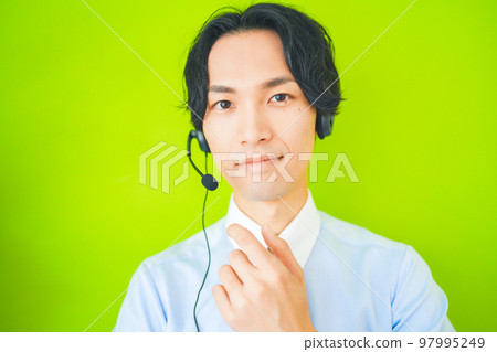 Inside salesman doing business with a headset on Inside salesman doing business with a headset on 97995249