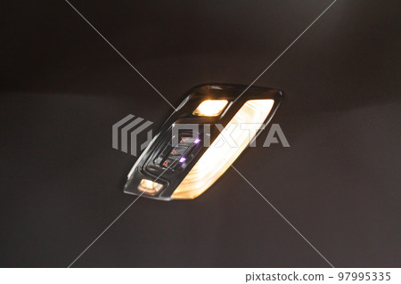 Car ceiling lamp in a car. Modern car interior lights close-up. 97995335